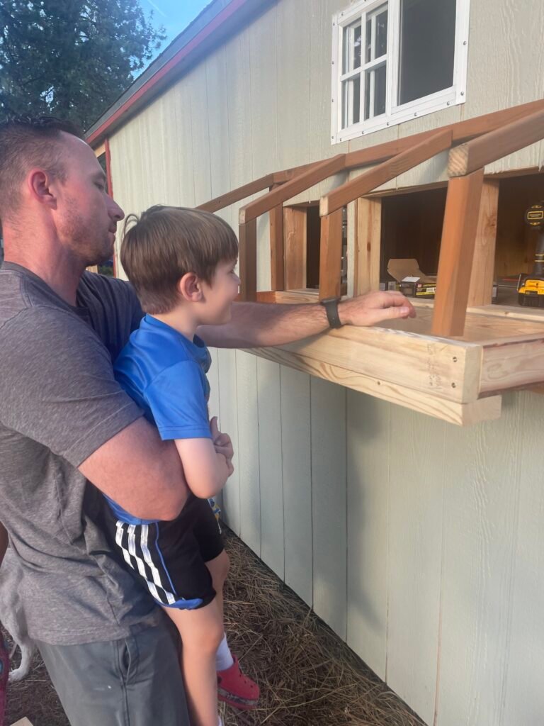 Luke is showing off the built in nesting boxes. Our kids are excited about the coop as well.