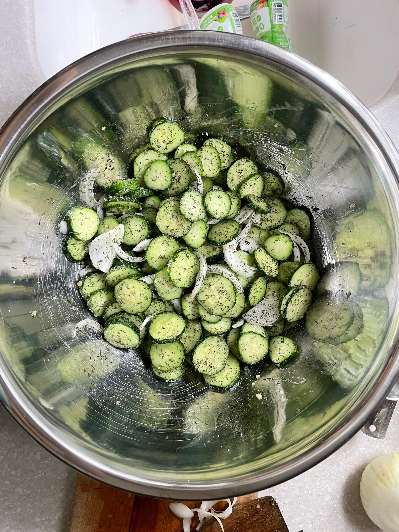 Sliced cucumber marinade in sugar, salt and spices for 1-2 hours to release extra liquid before they're stored overnight in vinegar to become pickles.