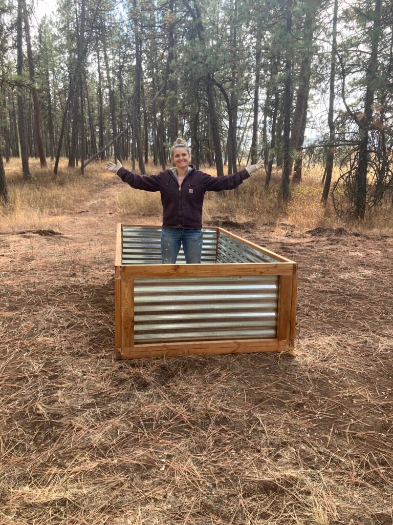 Standing inside one of the raised beds that I built.
