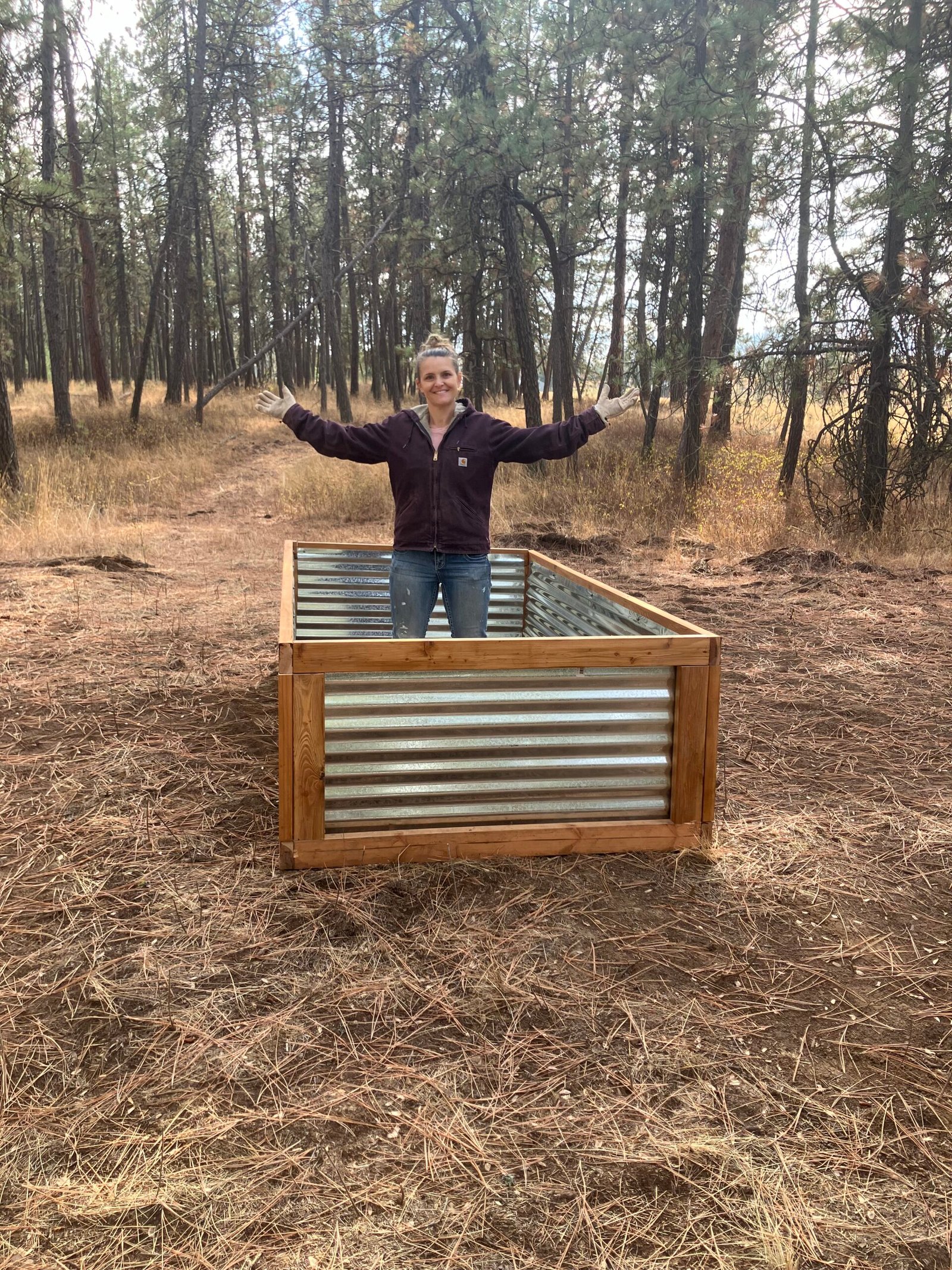 Standing inside one of the raised beds that I built.