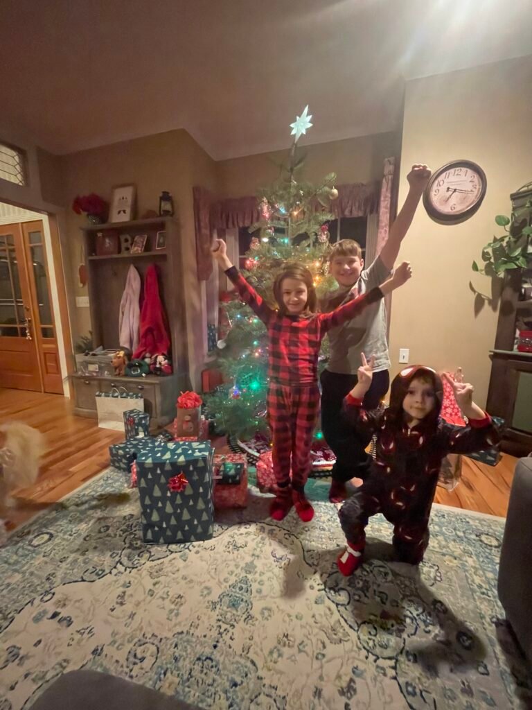 The kids pose near our tree.